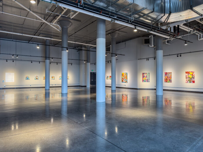 install shot of a very large gallery space with art on the walls